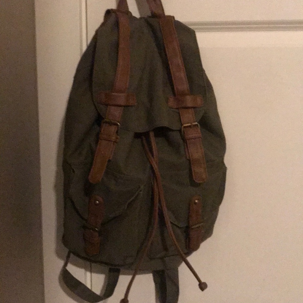 Green backpack from Target with leather straps